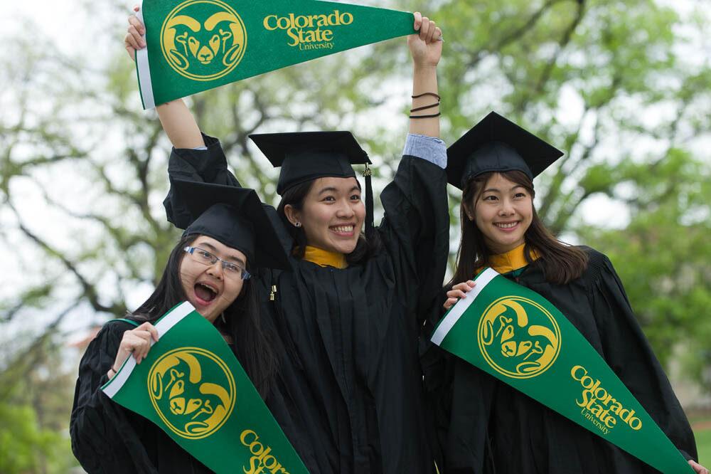 Foreign Trade University Graduates posing with CSU flags