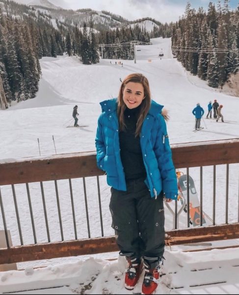 CSU student Macey Dodd stands in front of a ski hill